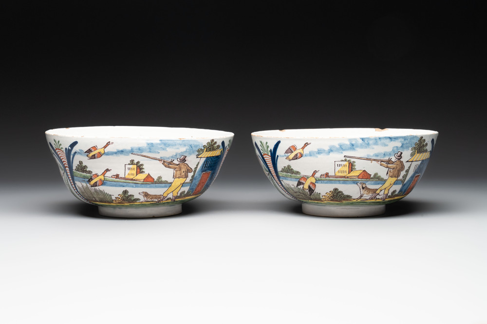 A pair of polychrome Dutch Delft 'duck hunt' bowls, 18th C.