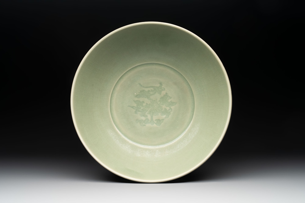 A Chinese Longquan celadon bowl with 'anhua' floral design, Ming