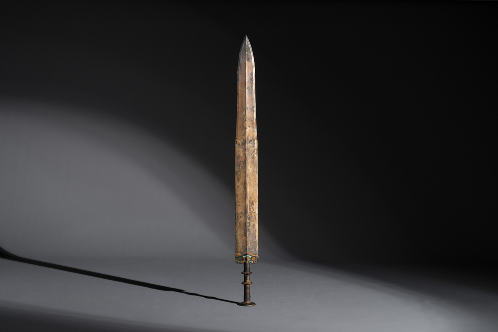 A rare Chinese turquoise-inlaid parcel-gilt bronze sword, Zhou