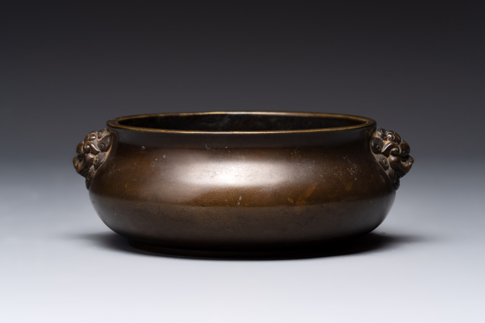 A Chinese bronze censer with lion-form handles, 大明宣德五年監造工部官監吳邦佐造 mark, 18th C.