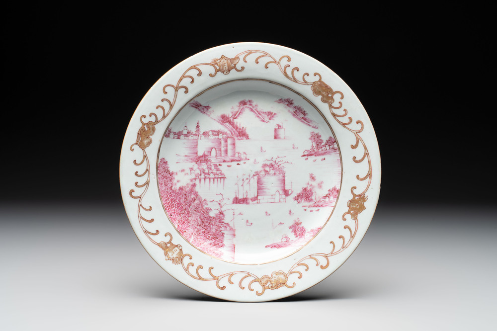 A Chinese puce-enamelled and gilt-decorated 'harbour scene' plate, Qianlong