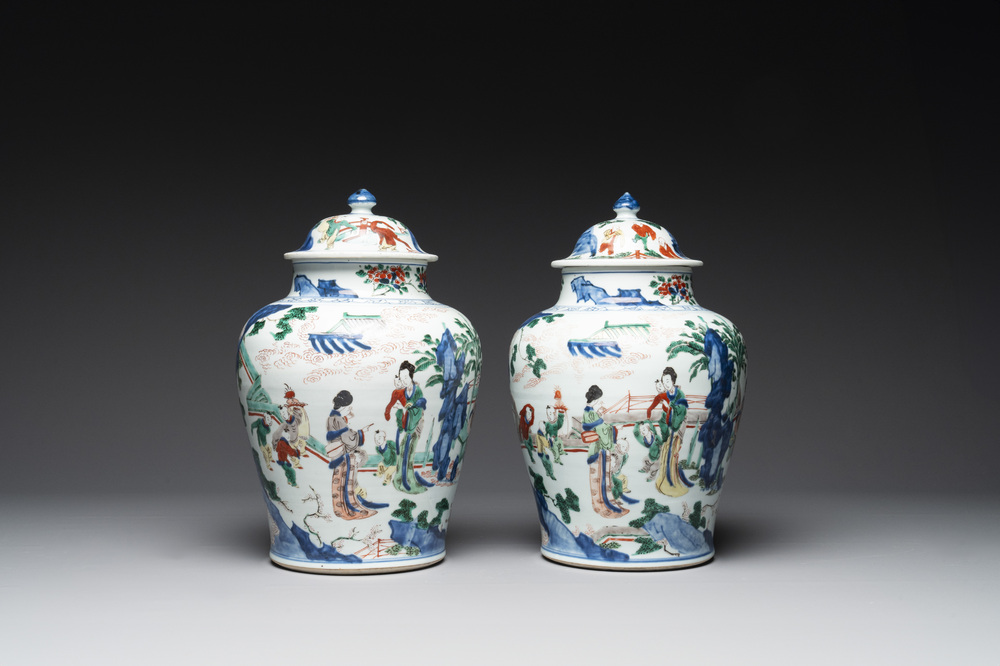 A pair of Chinese wucai vases and covers with court ladies and playing boys, Transitional period