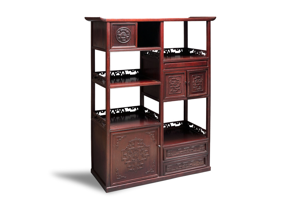 A Chinese carved wooden cabinet with chilong design, 20th C.