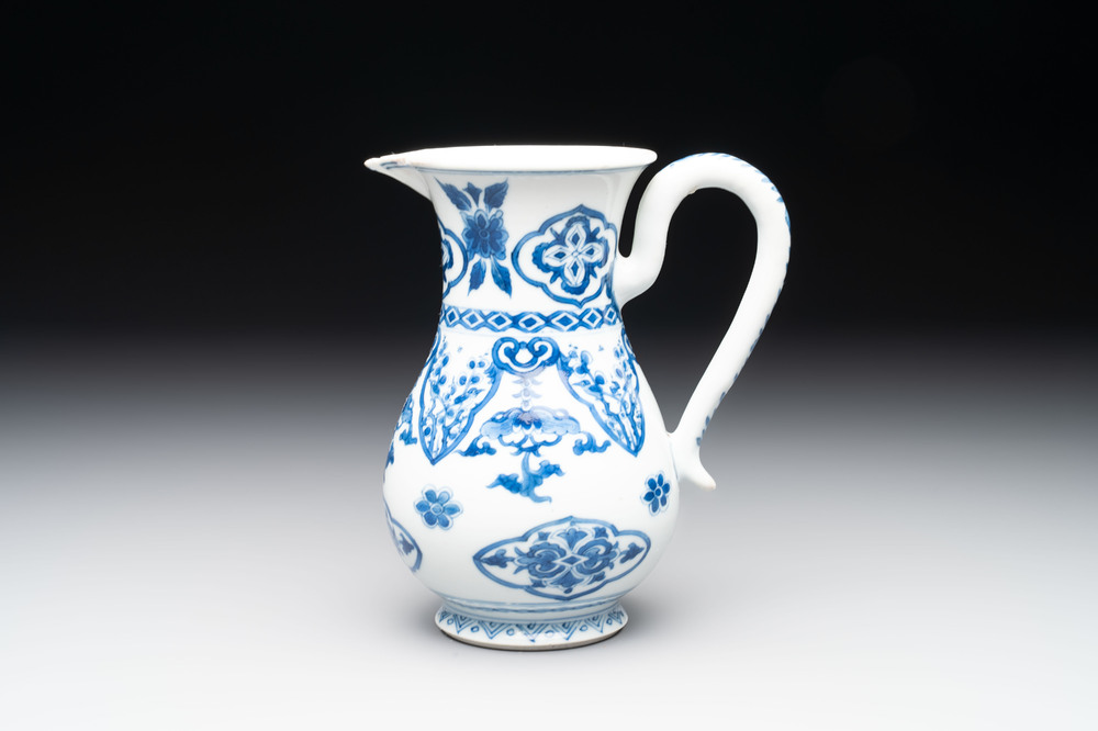 A Chinese blue and white jug with floral design, Kangxi