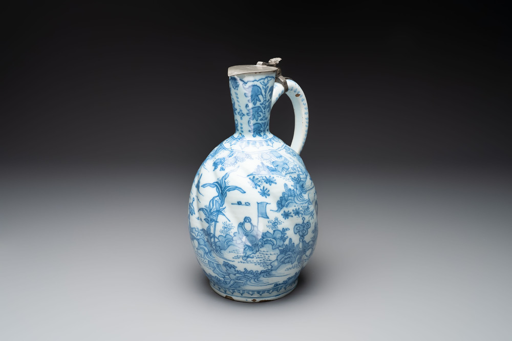 A large blue and white Dutch Delft chinoiserie jug with a mounted pewter lid, 17th C.
