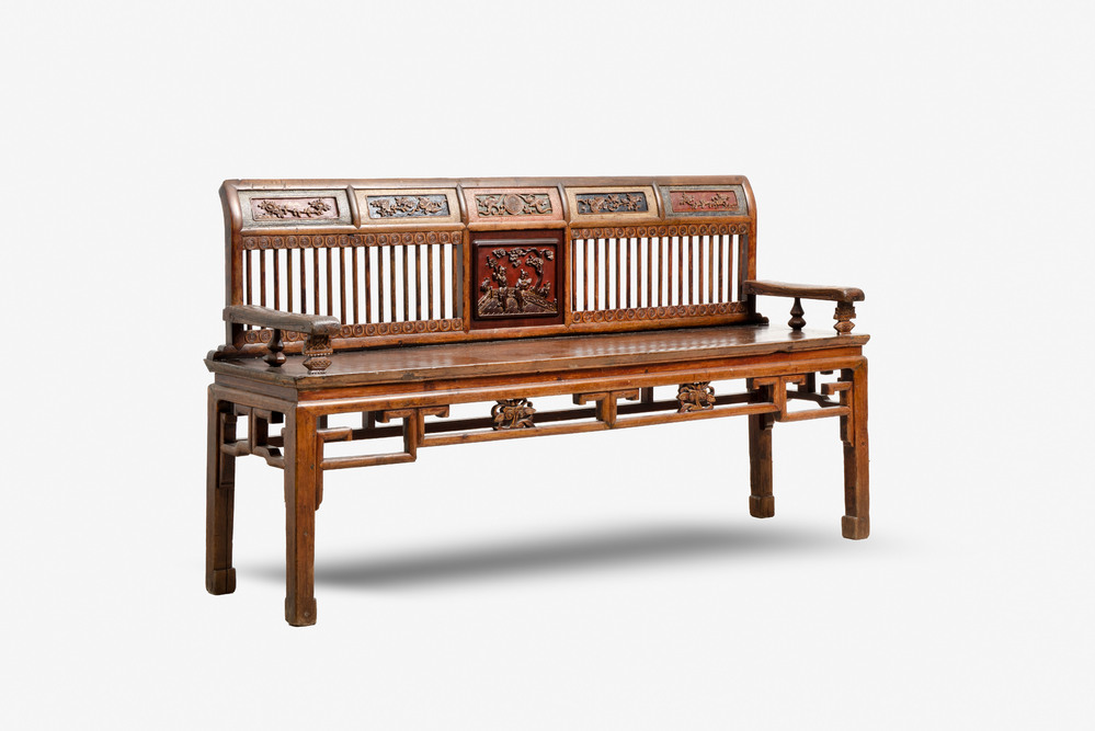 A Chinese carved and lacquered wooden bench, 19th C.
