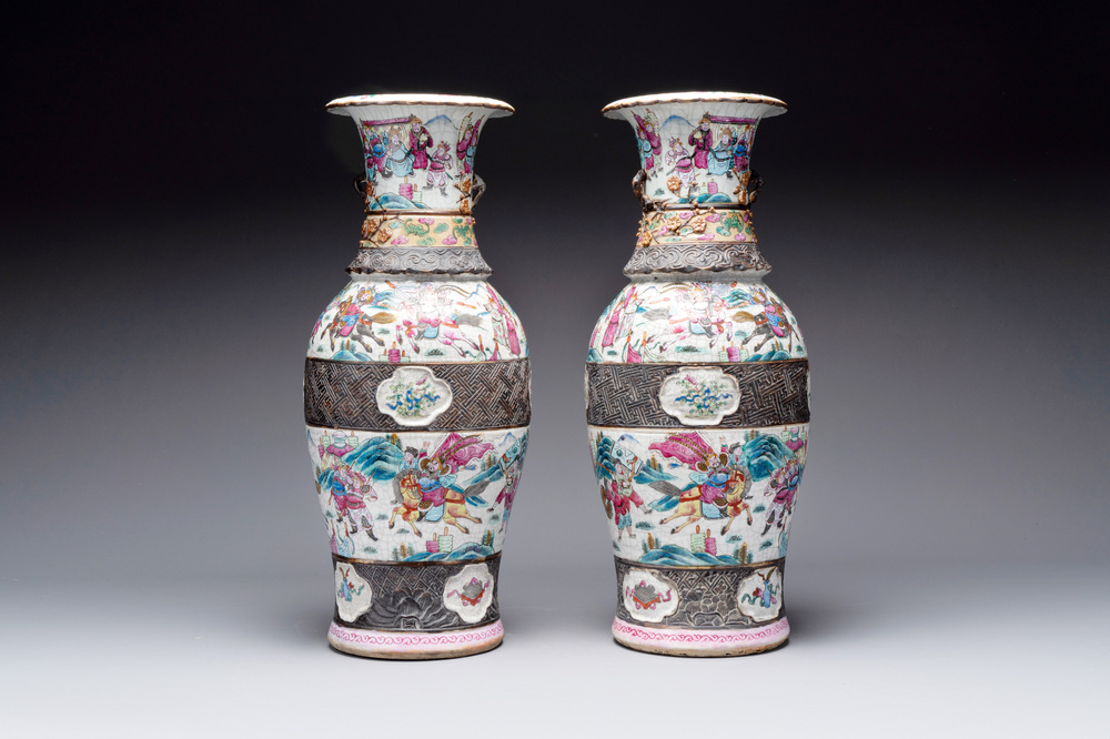 A pair of Chinese Nanking famille rose vases with narrative design, 19th C.