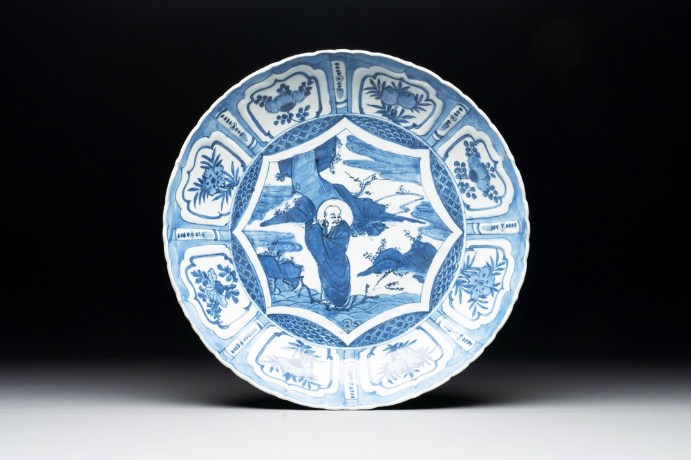 A Chinese blue and white 'kraak' dish with Damo in a landscape, Wanli
