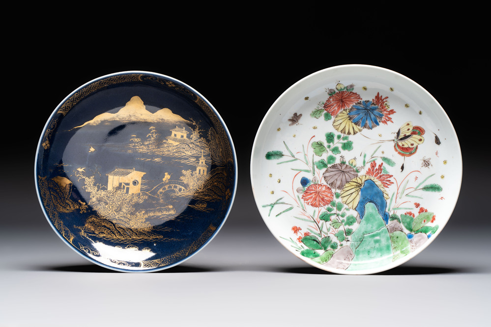 A Chinese gilt-decorated powder-blue plate and a famille verte plate with flowers, Kangxi/Qianlong