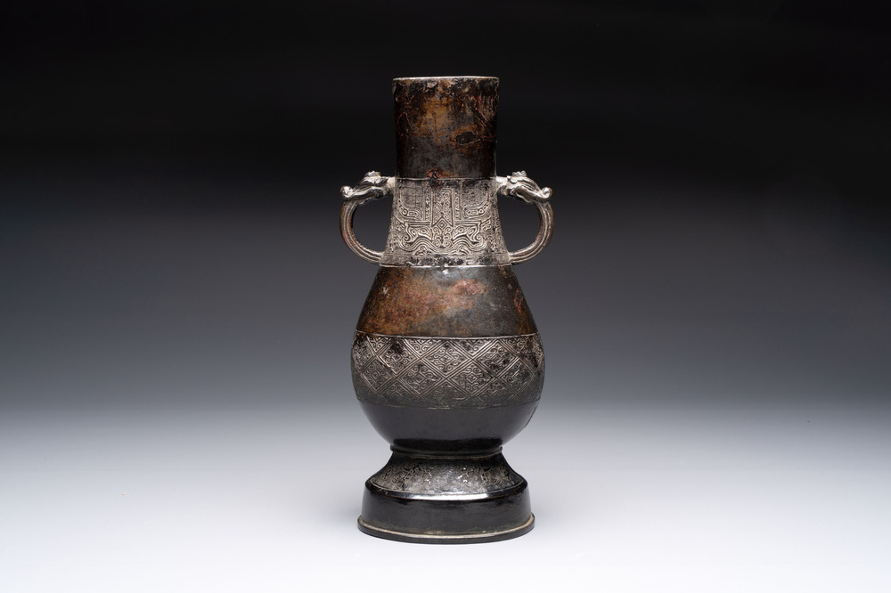 A fine Chinese archaistic bronze 'hu' vase with dragon handles, Yuan