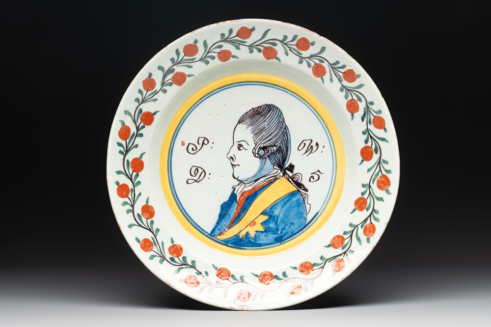 A polychrome Dutch Delft 'orangist' 'royal portrait' plate, 18th C.