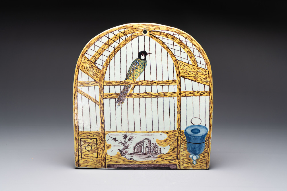 A polychrome Dutch Delft 'bird cage' plaque, 18th C.