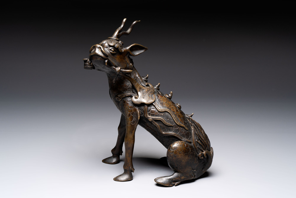 A fine Chinese bronze incense holder in the form of a qilin, Ming