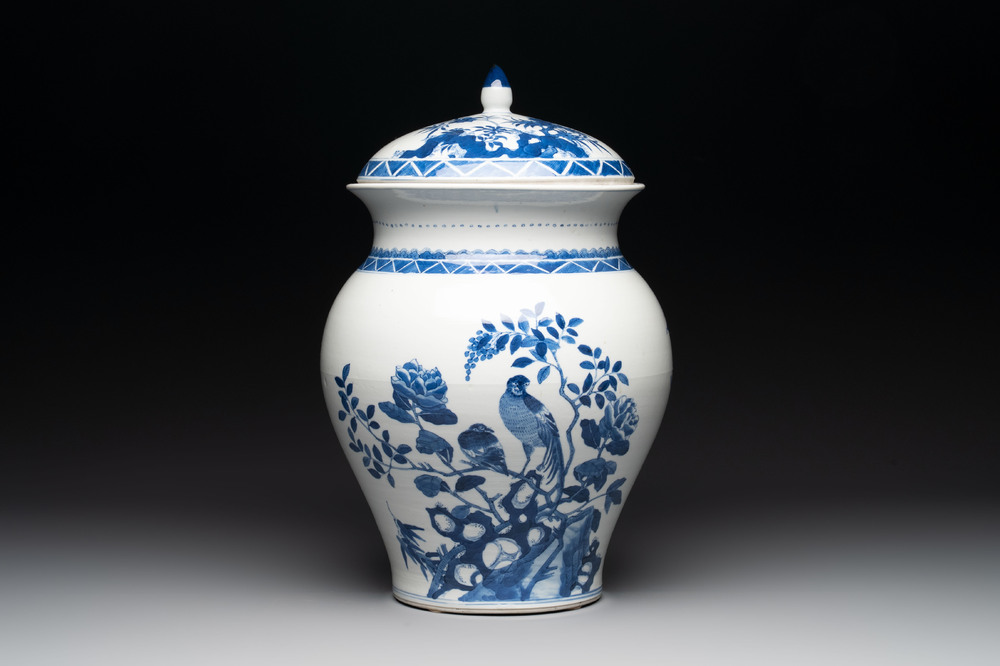 A Chinese blue and white 'birds among flowering branches' vase and cover, 19th C.