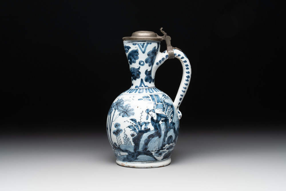 A blue and white Dutch Delft ewer with a mounted pewter lid, 17th C.
