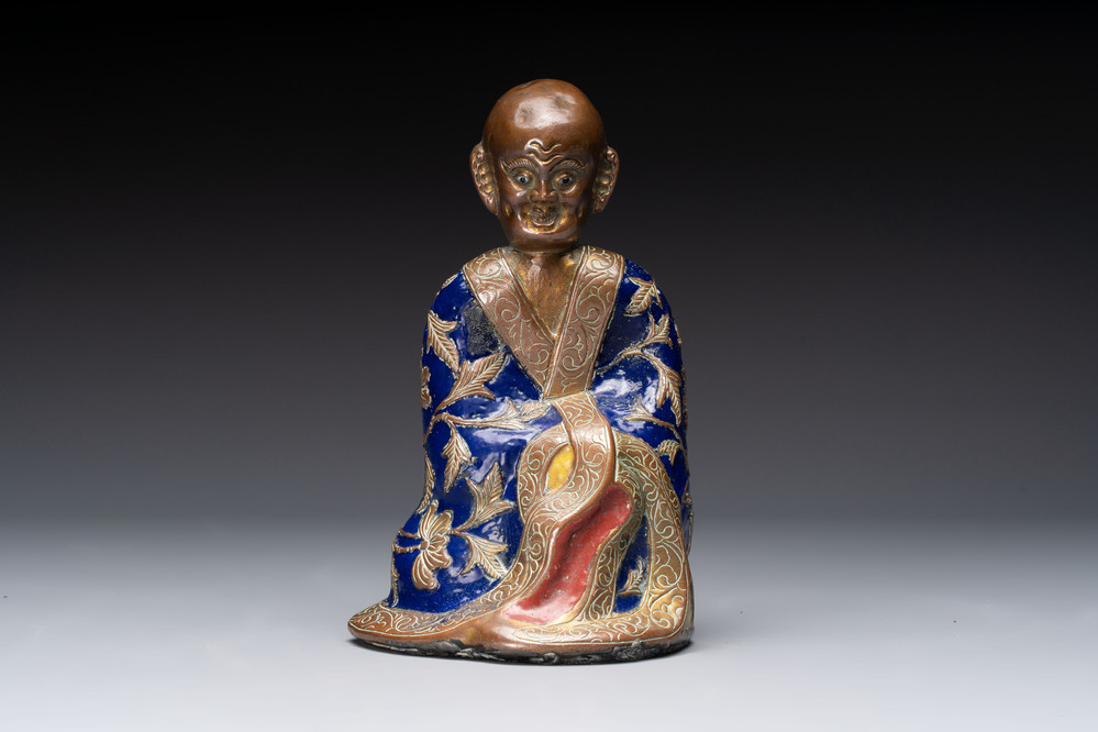 A Chinese champlev&eacute; figure of Luohan, Qianlong mark, 18/19th C.