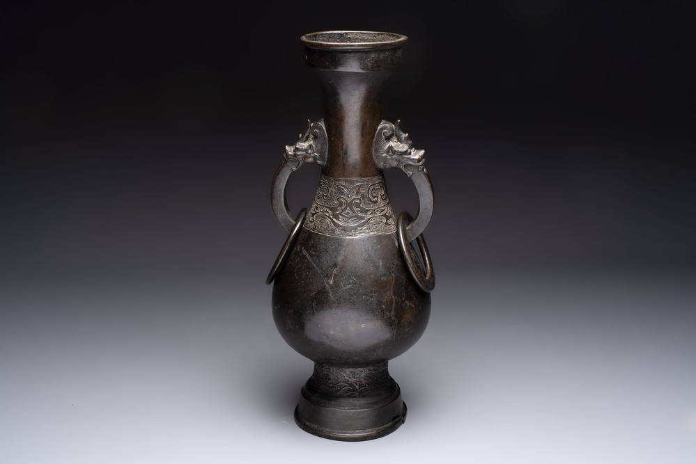 A large Chinese bronze 'hu' vase with luduan-form handles, Yuan
