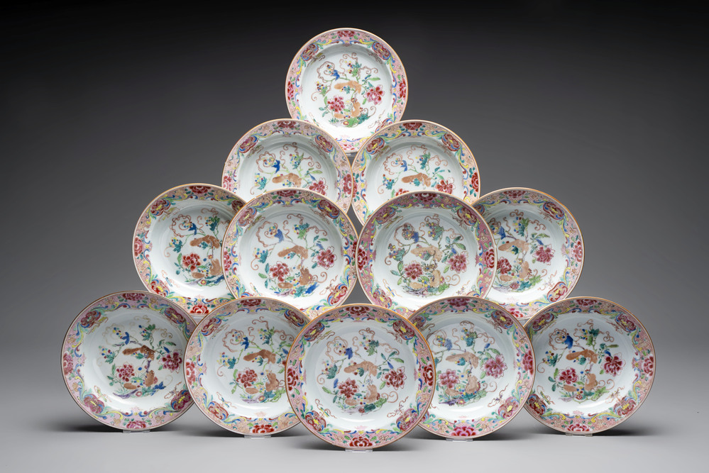 A set of 12 Chinese famille rose plates with squirrels among grapes and peonies, Qianlong