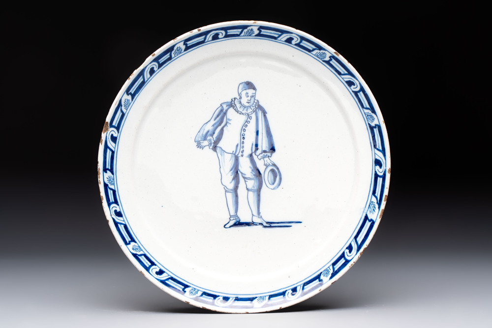 A rare blue and white Dutch Delft plate depicting Pierrot or a Commedia Dell'Arte figure, 18th C.