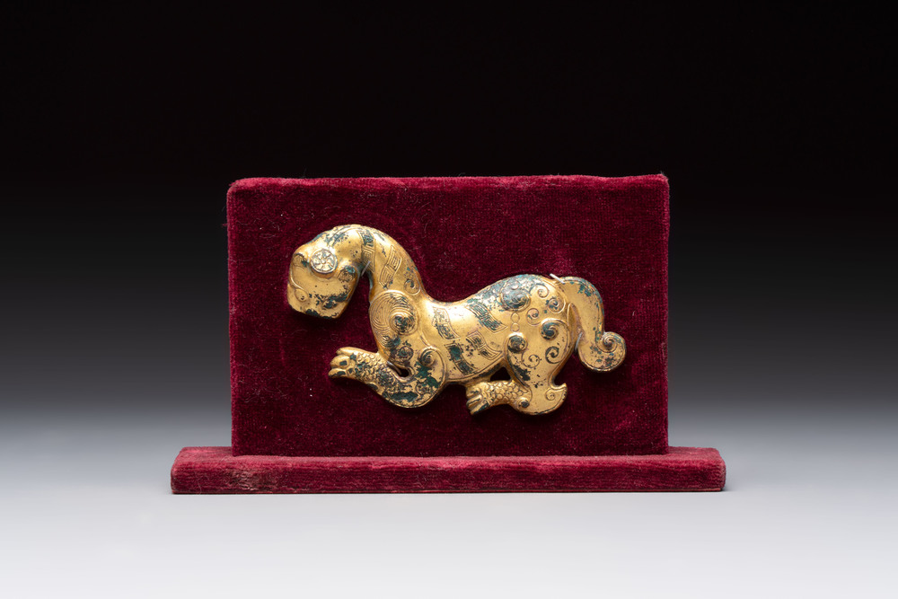 A rare Chinese gilt-bronze 'tiger' ornament, Han