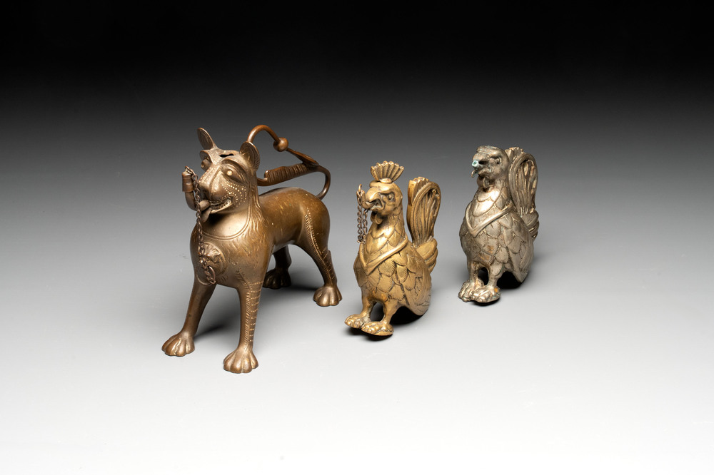 A bronze lion-form aquamanile and two rooster-form aquamanilia, one chromed, Germany, 19th C.