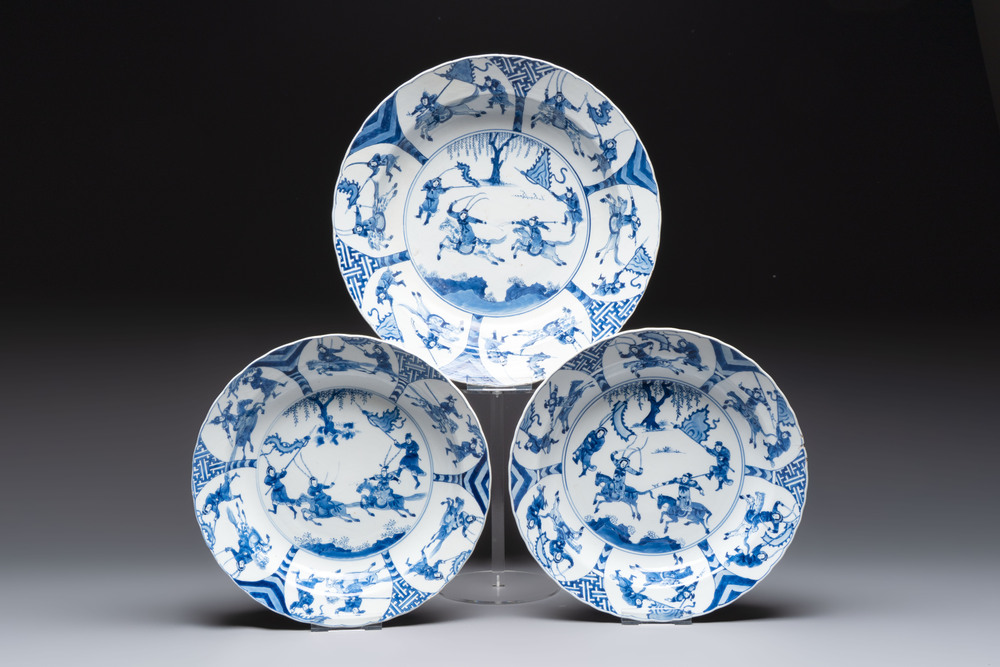 Three large Chinese blue and white 'hunting scene' deep dishes, Chenghua mark, Kangxi