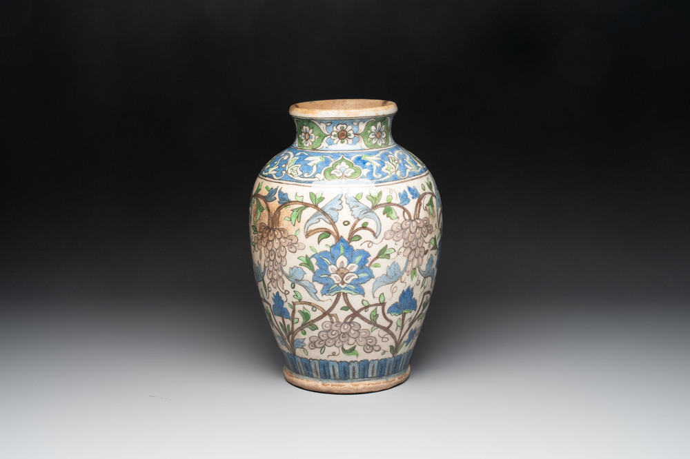 A Qajar polychrome pottery 'flower scroll' vase, Iran, 19th C.