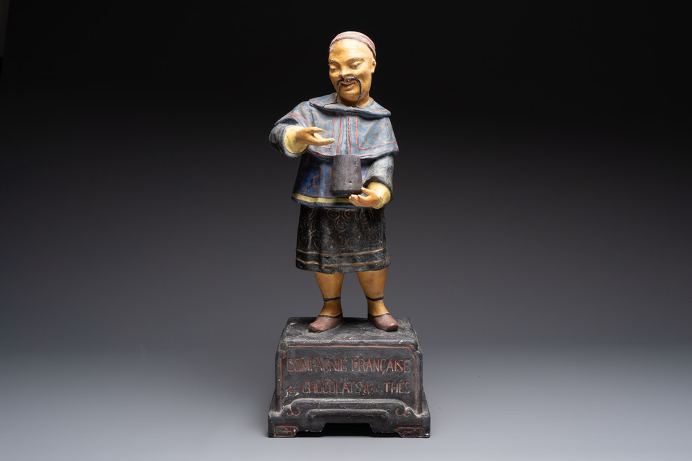 A French papier-m&acirc;ch&eacute; figure of a mandarin, inscribed 'Compagnie Fran&ccedil;aise Des Chocolats et Des Th&eacute;s', 20th C.