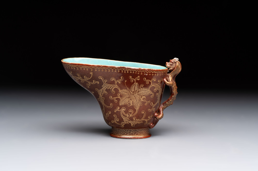 A Chinese gilt-decorated brown-glazed libation cup with a chilong-form handle, Qianlong mark and of the period