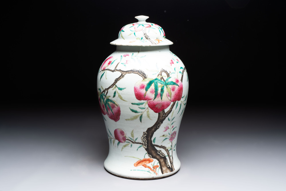 A Chinese famille rose 'nine peaches' vase and cover, 19th C.