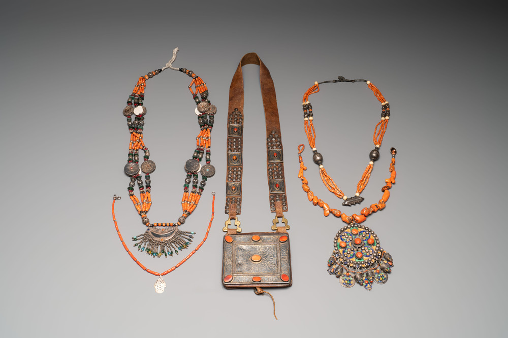 A varied group of four Islamic necklaces and a Quran holder, 19th C.