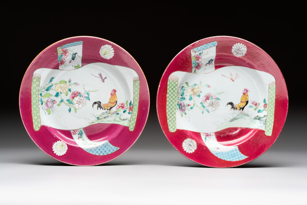 A pair of Chinese famille rose ruby-ground 'scrolls and rooster' plates, Yongzheng