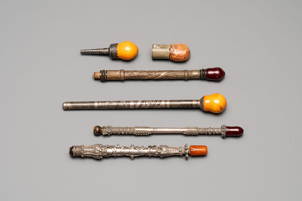 Four Ottoman silver niello cigarette holders with amber and cherry amber, and two hookah mouthpieces for the Islamic market, 19th C.