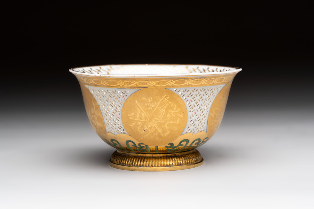 A Chinese European-decorated gilt bronze-mounted blue and white reticulated bowl, Transitional period