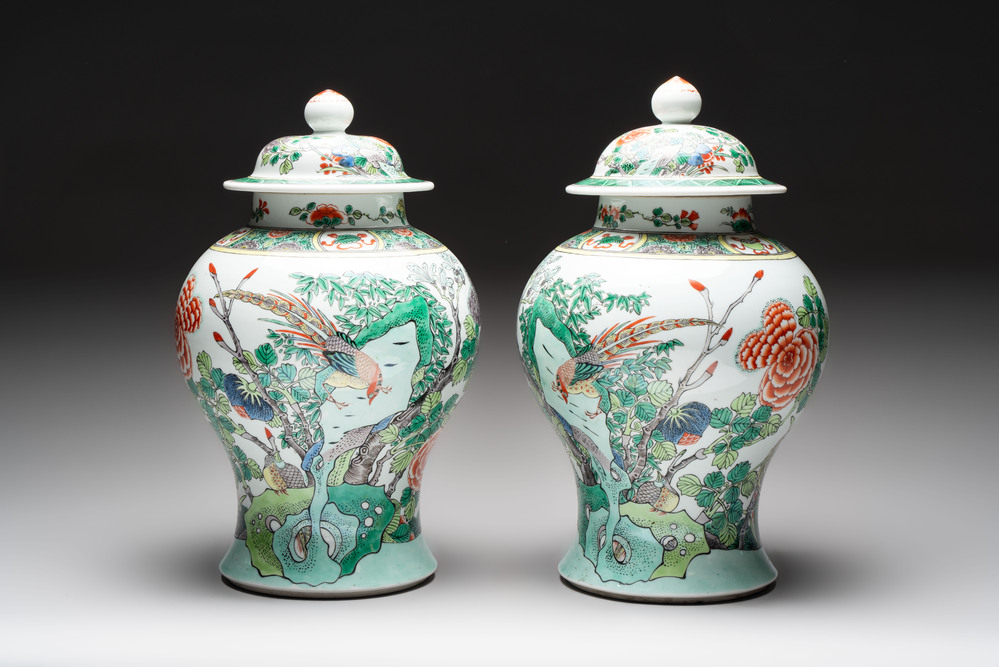 A pair of Chinese famille verte 'birds and flowers' vases and covers, 19th C.