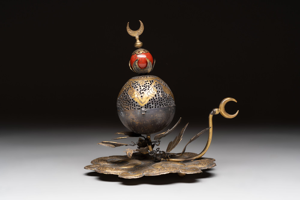 An Ottoman gilt-bronze inscribed incense burner with a red stone, 19th C.