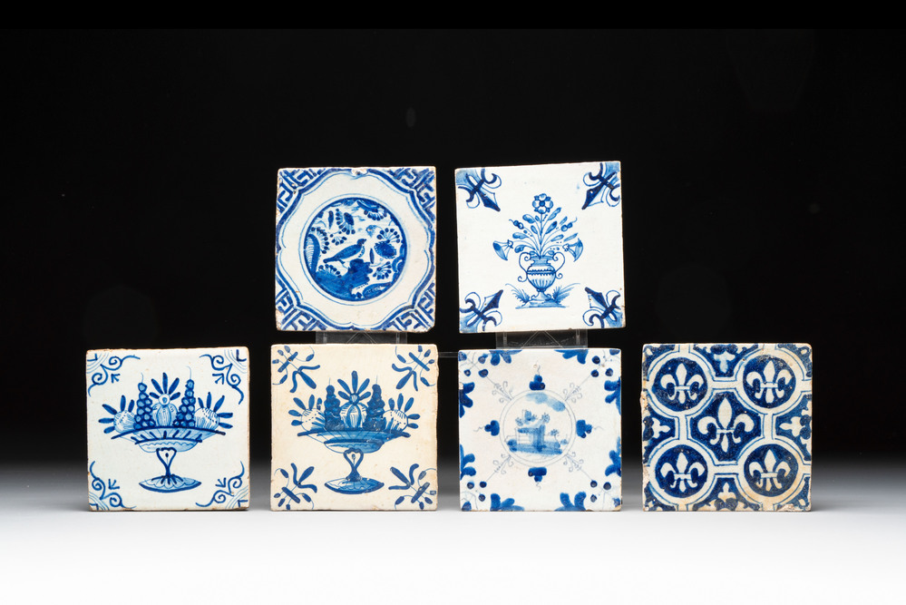 Six blue and white Dutch Delft 'French lilies', 'fruit bowls', 'Chinese gardens' and 'flower vases' tiles, 17th C.