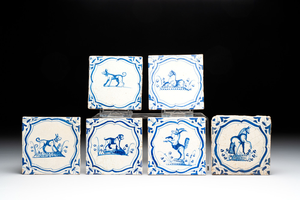 Six blue and white Dutch Delft 'accolades borders' 'animals' tiles, 17th C.