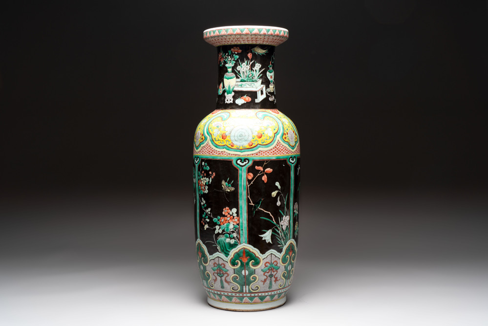 A fine Chinese famille noire 'antiquities' vase, 19th C.