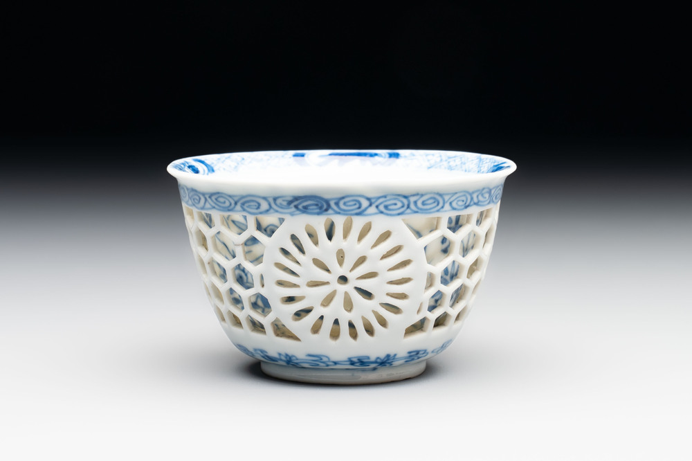 A Chinese blue and white reticulated double-walled cup, ruyi mark, Kangxi