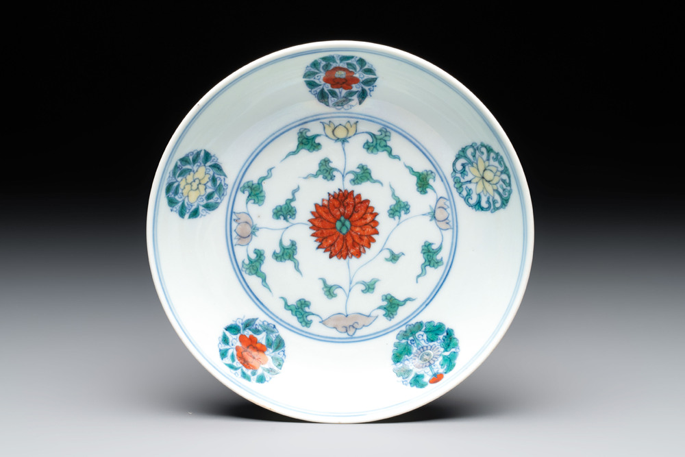 A Chinese doucai plate with stylised floral design, Chenghua mark, Kangxi/Yongzheng