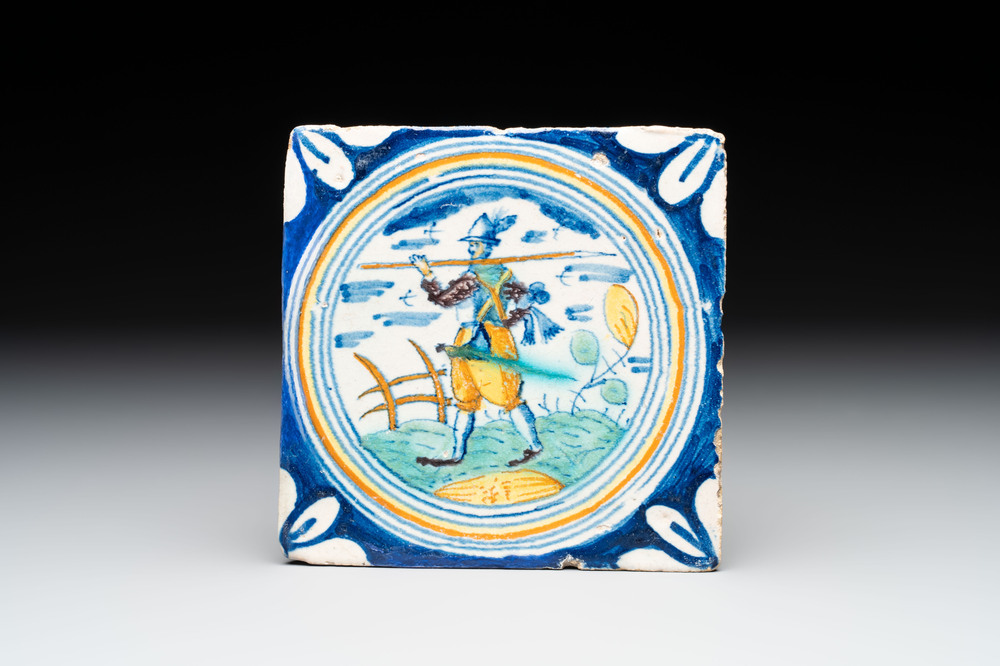 A polychrome Dutch Delft maiolica 'soldier' ​​medallion tile, late 16th C.