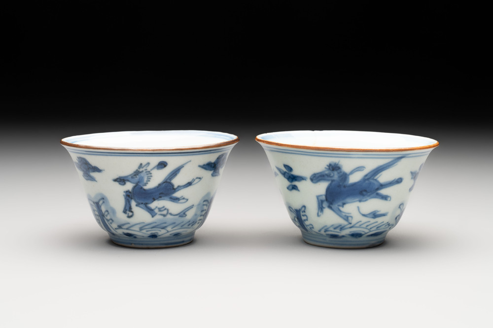 A pair of Chinese blue and white 'flying horses' cups, Jiajing mark, Kangxi