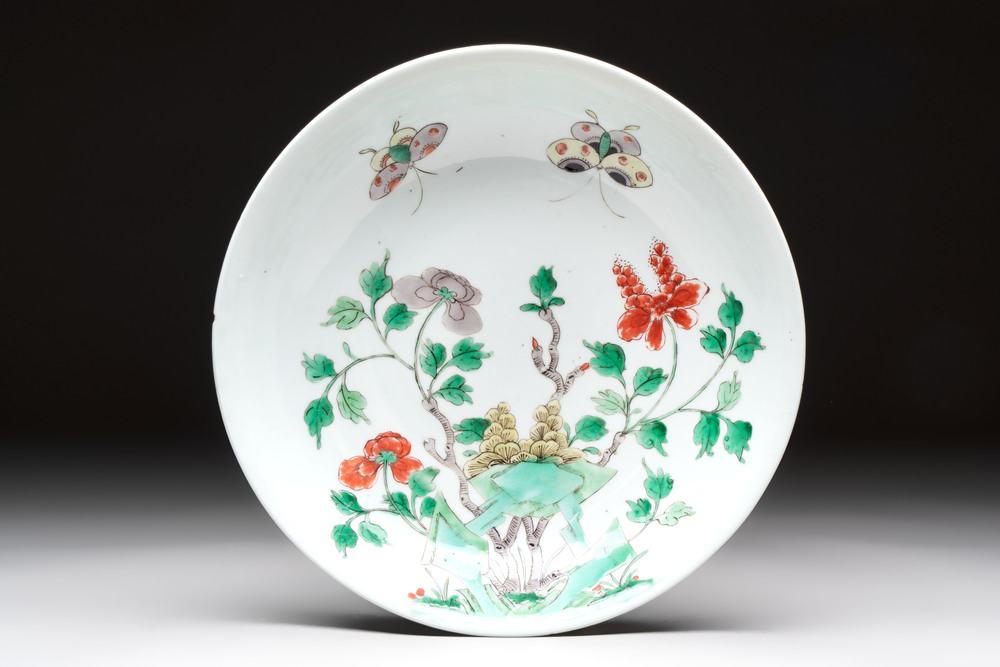 A Chinese famille verte 'peonies and butterflies' plate, Kangxi