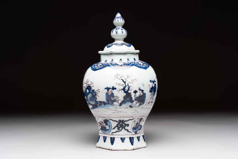 A blue, white and manganese Dutch Delft chinoiserie vase and cover, ca. 1700