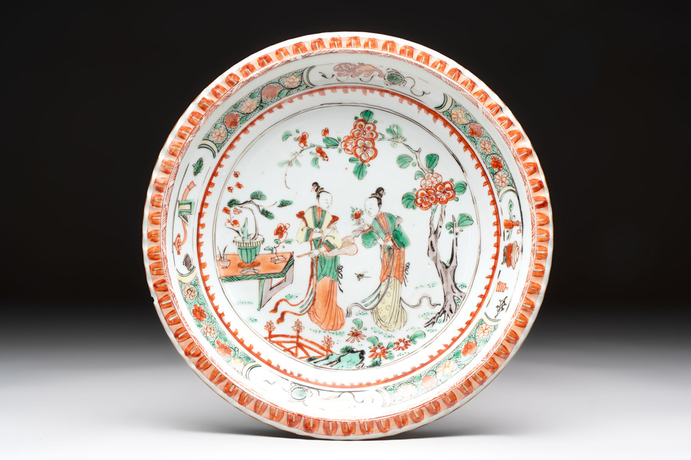 A Chinese famille verte 'elegant beauties in a garden' plate, Kangxi