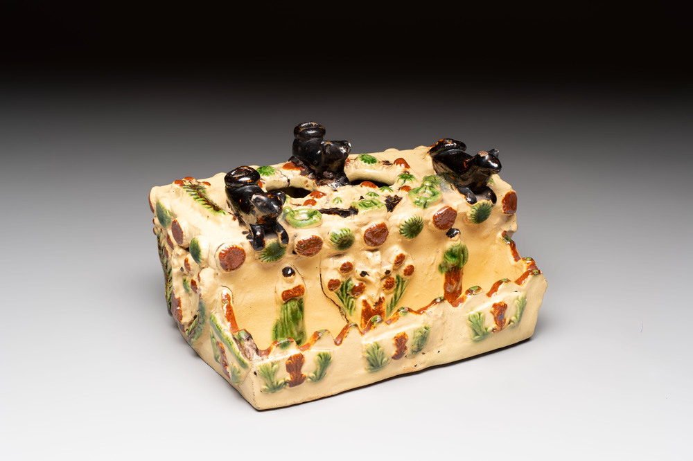 A polychrome-glazed inkwell with relief design, possibly Italy or France, 18/19th C.