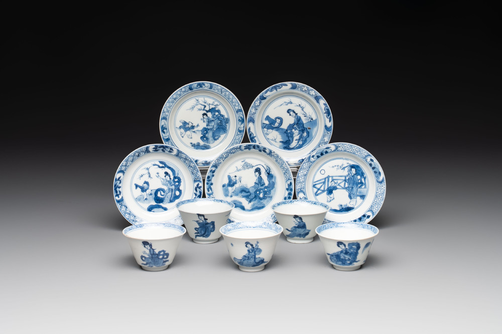 Five Chinese blue and white 'elegant beauty and boy' cups and saucers, Chenghua mark, Kangxi