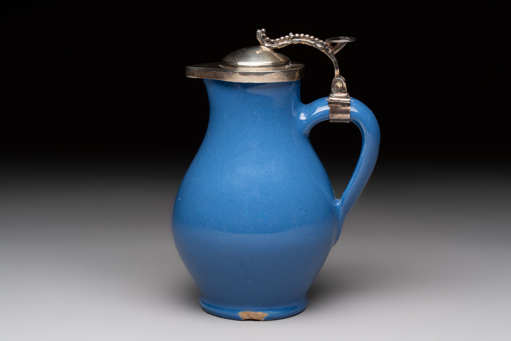 A very rare blue-glazed Dutch Delft jug with a mounted silver cover, 18th C.