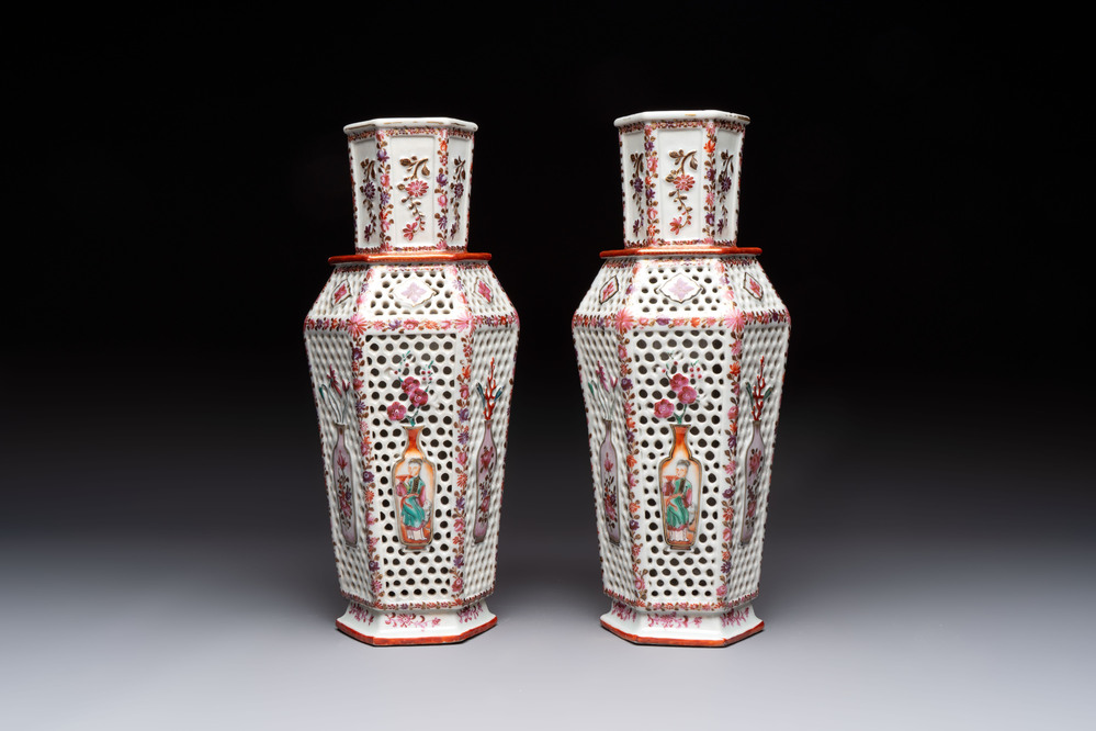 A pair of Chinese famille rose reticulated double-walled 'mandarin subject' vases, Qianlong